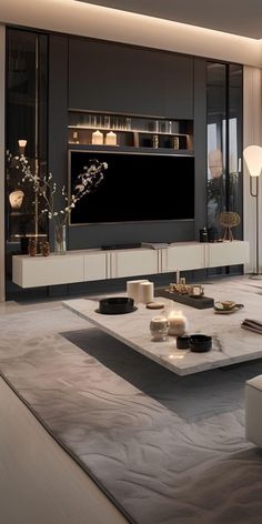 a living room filled with furniture and a flat screen tv mounted to the side of a wall