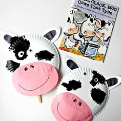 two paper plates with black and white cows on them