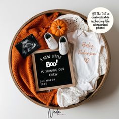 a baby's first birthday gift basket with personalized onesuits and other items