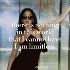 a woman in a black dress is holding her arms out with the words there is nothing in this world that i cannot have i am limitless