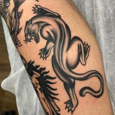 a lizard tattoo on the arm and shoulder