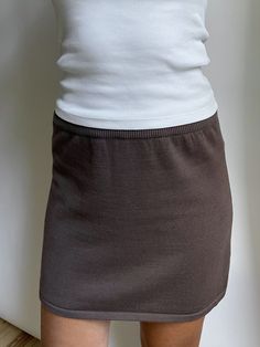 Our Knitted Mini Skirt is designed with comfort and style in mind. It is made of 100% certified organic cotton and is slightly a-lined with a rib knitted elastic waistband. Wear it with our Button Up Cardigan and Knitted Scarf for the ultimate look. Knitted Mini Skirt, Everyday Tank Tops, Djerf Avenue, Tube Skirt, Button Up Cardigan, Tank Top Long Sleeve, Maxi Skirts, Sweaters And Jeans, Gray Skirt