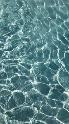 the water is very clear and blue with some ripples on it's surface