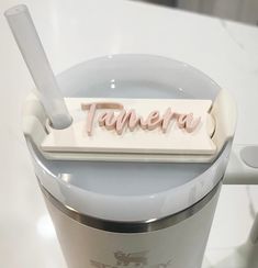 the name tamera is placed on top of a cup with a toothbrush in it