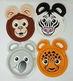 four paper plates with animal faces on them