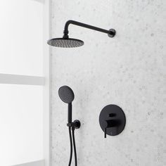 a black shower head with thermostaer and hand held shower faucet