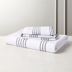 two white and black towels on top of each other