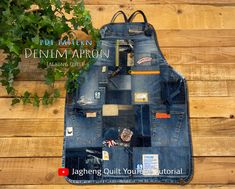 an apron made out of jeans with patches on it