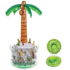 an inflatable palm tree with beer bottles on it and other items around it