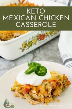 mexican chicken casserole on a white plate with green peppers and sour cream in the background