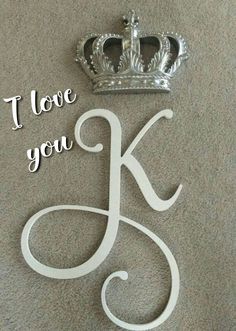 i love you k and crown on the floor with words above it that read, i love you k