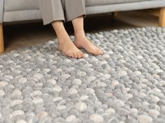 the feet of a person sitting on a couch