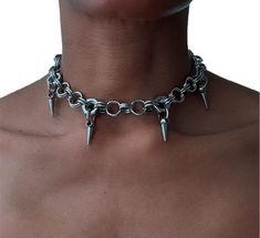 Unique statement piece to compliment any outfit Stainless steel Nuts & chainmail Choker design Spike pendants Chain length approximately 34cm Chain extension 10cm  Processing, Delivery, and Shipping  Please order in good time Processing time & delivery time are separate PLEASE NOTE:  On the very rare occasion due to custom delays please contact us after 30 days if you have not received your package. On the rare occasion when a buyer has not been around to receive their package, has failed to rea Gothic Chainmail Metal Jewelry, Silver Chainmail Punk Jewelry, Gothic Metal Chainmail Choker, Gothic Stainless Steel Chainmail Jewelry, Gothic Silver Metal Choker, Silver Gothic Metal Choker, Edgy Silver Metal Necklace, Metal Chainmail Necklace For Party, Party Chainmail Metal Necklace