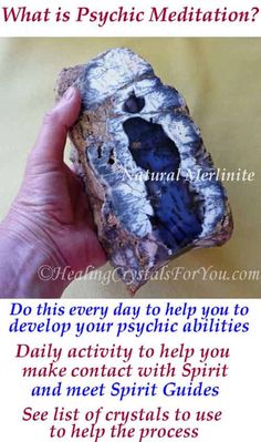 a person holding up a rock with the words psychic meditation on it and an image of a