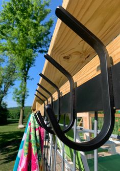 an umbrella rack is attached to the side of a house