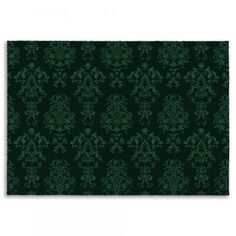 a green and black wallpaper with an ornate design on it's side,