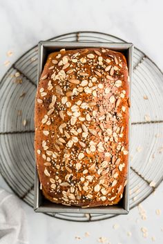 a loaf of bread sitting on top of a cooling rack