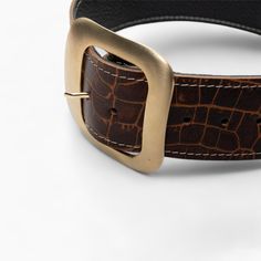 Upgrade your wardrobe with this exquisite brown leather belt, designed for the discerning individual who values both style and substance. Featuring a robust square matte gold buckle, this belt is more than just an accessory--it's a statement piece. Handcrafted from premium genuine leather with a distinctive crocodile embossed pattern, this belt blends durability with a refined aesthetic that's perfect for both casual and formal wear. Premium Quality & Materials: Crafted from top-grade genuine le Embossed Design, Brown Leather Belt, Suspender Belt, Formal Attire, Matte Gold, Classic Elegance, Suspenders, Formal Wear, Everyday Look