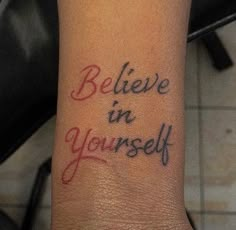 a tattoo saying believe in yourself on someone's wrist with the words below it