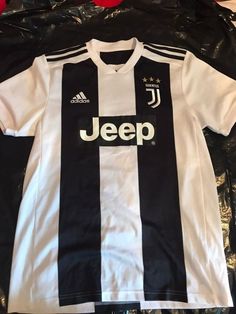 a black and white jersey with the word jeep on it