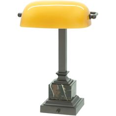 a table lamp with a yellow shade on it