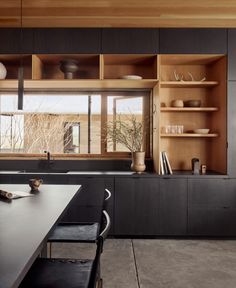 the kitchen is clean and ready to be used as a dining room or office area