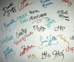 many different colored writing on a white wall