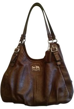 Coach Madison Maggie Shoulder Bag. Get one of the hottest styles of the season! The Coach Madison Maggie Shoulder Bag is a top 10 member favorite on Tradesy. Save on yours before they're sold out! 2000s Coach Bag, On-the-go Brown Coach Bags, Retro Brown Coach Bag, Coach Brown Bags For On-the-go, Brown/black Coach Bag, Purse Brands, Coach Shoulder Bag, Recycled Denim, Hot Outfits