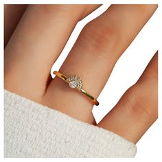 a woman's hand with a ring on it