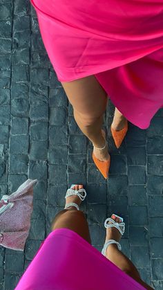 two women standing next to each other on a brick road with the caption send message