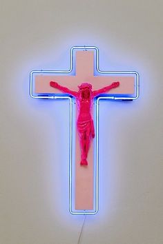 a neon cross with a person on it