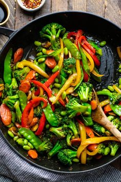 broccoli and peppers stir fry in a skillet