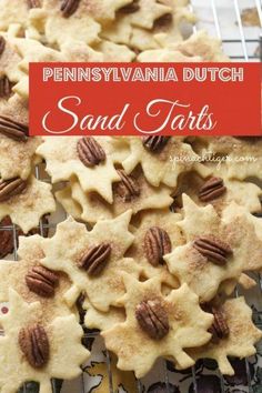 some cookies with pecans on top and the words, pennsylvania dutch sand tarts