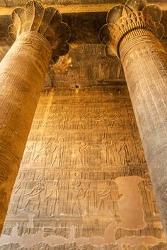 two large pillars with carvings on them in an ancient building