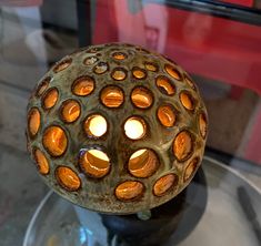 a glass table with a candle holder on it