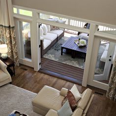 an aerial view of a living room with couches, chairs and coffee table in it