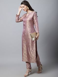 For those who want ethnic but also go with the latest trends, Lilac Charm brocade suit set is the one for you. A simple sillouette with a lusture of its own giving all the glam you need for an indian party. Complete the outfit with delicate jewellery. Top Deatails Length of kurta :46 Shape :Straight Fabirc :Brocade Colour :Lilac Work :Jacqard Neck Line :Round NECK Bottom Details Length :38 Style :Trouser Fabric :Brocade Closure :Slip on Wash & Care :Dry clean only Latest Pant Suit Designs For Women, Banarasi Suit Designs Indian Style, Benaras Dresses Designs, Banaras Dress Designs, Banaras Suit, Banarasi Kurti Designs Latest, Banarasi Kurti Design, Banarasi Kurta Designs Women, Straight Cut Kurti Designs