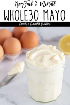 a glass jar filled with mayonnaise next to eggs