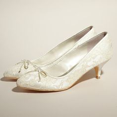 Elevate your bridal ensemble with these elegant white lace kitten heels. Adorned with charming bow embellishments, these shoes exude sophistication and grace for your special day. Color: White Material: Lace Heel Type: Kitten heel Heel Height: Below 60 mm approx Product measurements were taken using size 8. Please note that measurements may vary by size. Toe: Closed toe Bow embellishment Elegant lace upper design Handcrafted US sizing. Fits true to size. Wedding Shoes Kitten Heel, Bridal Shoes Lace, Kitten Heel Wedding Shoes, Ivory Bridal Shoes, Ivory Wedding Shoes, Lace Pumps, Kitten Heel Shoes, Dress Heels, Mid Heel Shoes