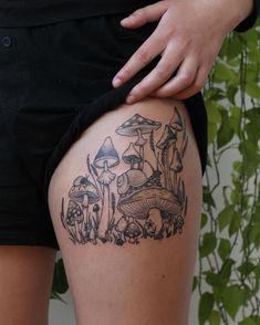 a woman's thigh with mushrooms on it