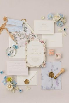 the wedding stationery is laid out on top of each other