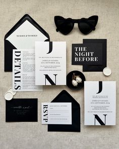 black and white wedding stationery with monogrammed details, sunglasses, and letterpress