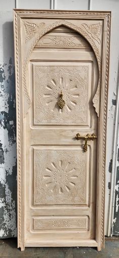 an ornate wooden door is shown in this image