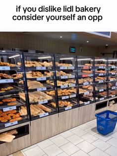 a display case filled with lots of different types of doughnuts and pastries