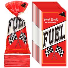 a bag of fuel sticks next to a box of matches and the package is red with white checkered flags on it