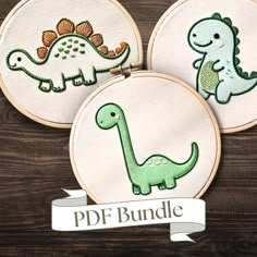 three embroidered dinosaurs on white hoop frames with the word pdf bundle written in green