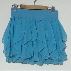 Brand New Without Tags In Perfect Condition Light Blue Stretch Skirt For Summer, Light Blue Flowy Skirt For Party, Flowy Light Blue Party Skirt, Blue Ruffled Mini Skirt For Beach, Blue Stretch Tiered Mini Skirt, Stretch Blue Tiered Skirt, Light Blue Casual Mini Skirt For Party, Casual Light Blue Mini Skirt For Party, Light Blue Flowy Mini Skirt