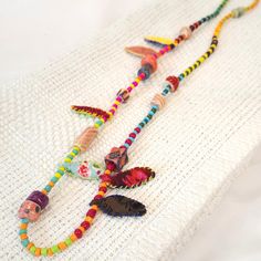 Add a pop of color and creativity to your outfit with this Unique Necklace for Woman. Handcrafted with fabric beads, this Boho Necklace is a standout piece of Textile Jewelry. Made with eco-friendly materials, this OOAK necklace is a perfect choice for the environmentally conscious fashionista. A statement accessory for any outfit , can be worn on both sides . Easy to wear and uniquely designed, this one of a kind necklace is ready to be shipped and is ideal for the creative lady looking to make Creative Woman, Sides Easy, Colorful Textiles, Jewelry Organizer Diy, Fabric Necklace, Textile Jewelry, Fabric Beads, Unique Necklace, Geometric Jewelry