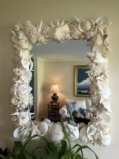 there is a mirror that has flowers on it