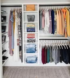 an organized closet with clothes and shoes